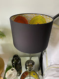 Double-sided ‘Hidden Circles 2' orange and yellow Ankara print lampshade